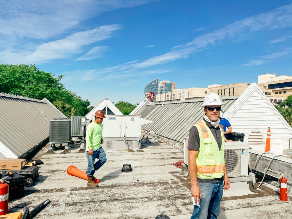 Construction worker on top of a roof