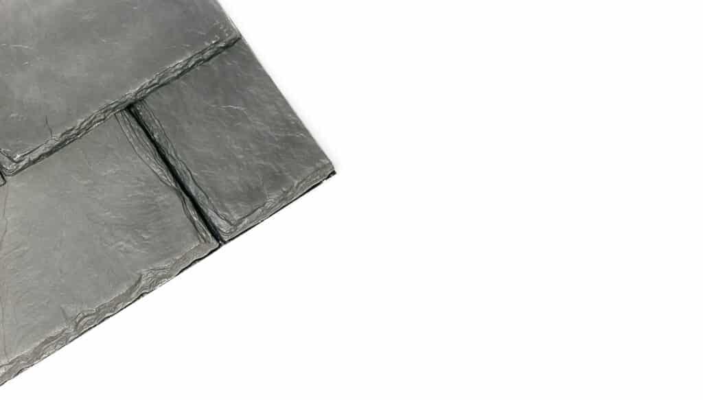 Synthetic slate tile roofing product on white background