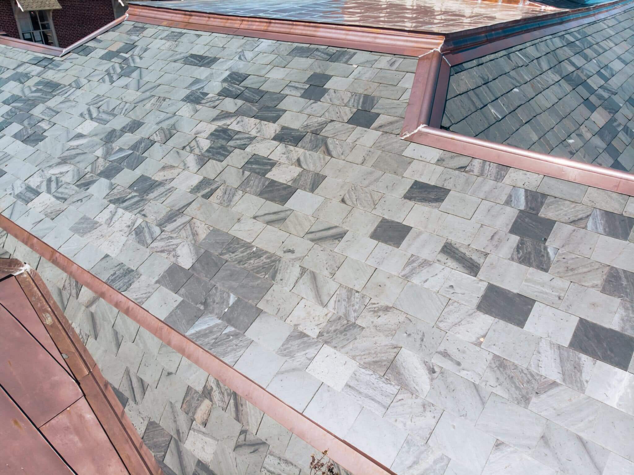 Gray and Blue slate roof with copper details