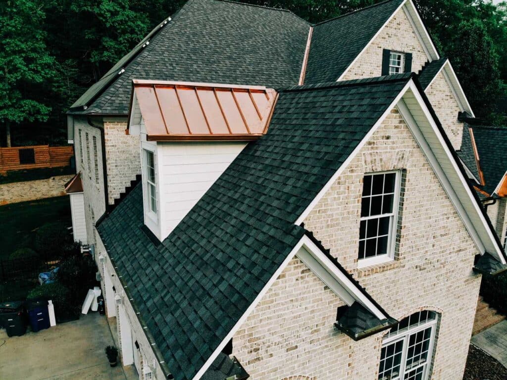 Black shingle roof with copper details
