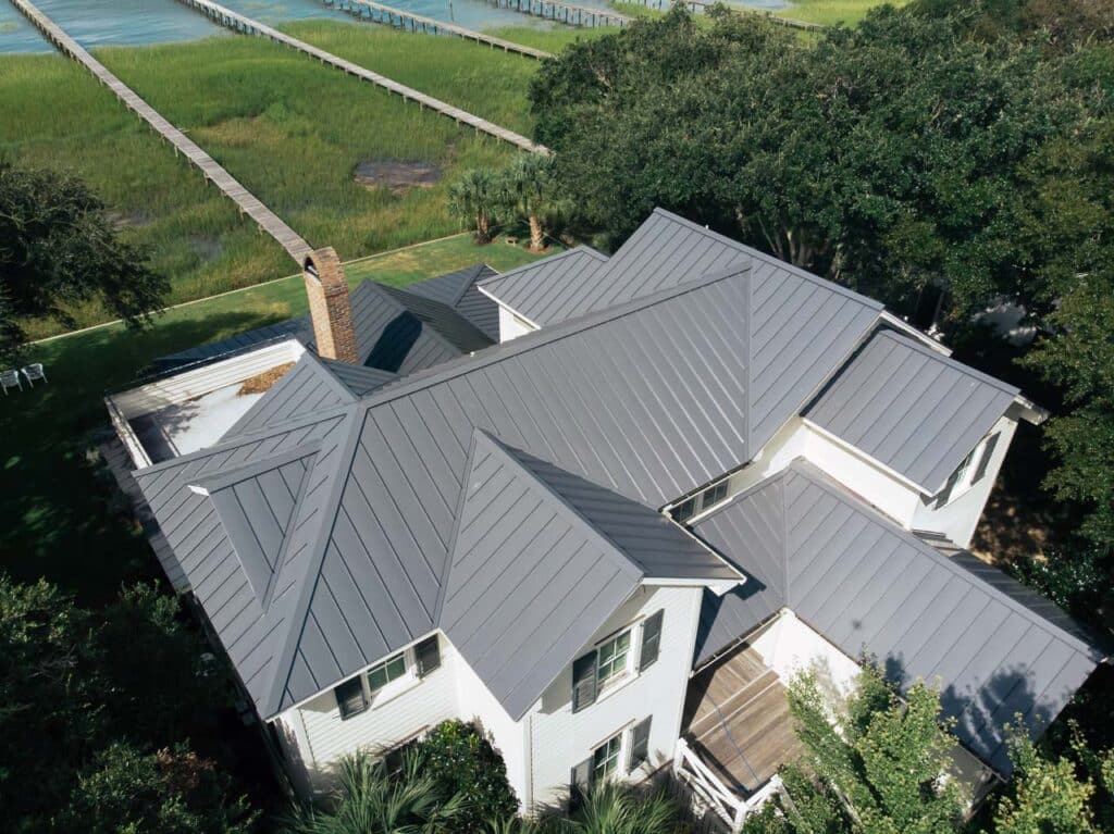 Aerial view of a gray metal roof on a waterfront house