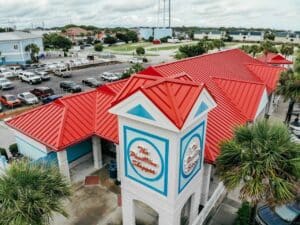 Aerial view of a painted red metal roof on Isle of Palms beach
