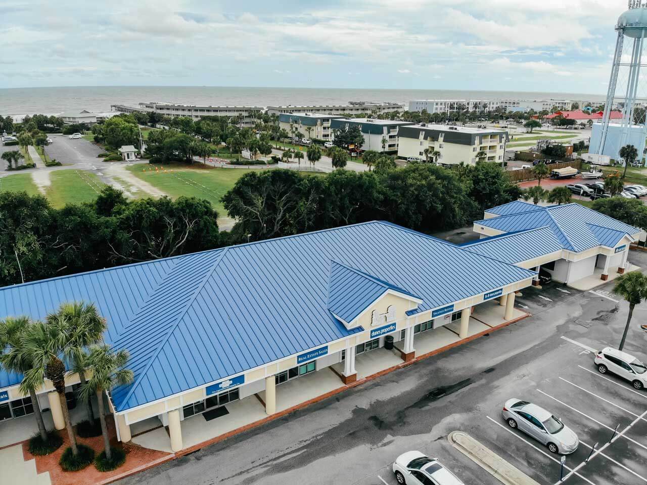 Aerial view of a painted blue metal roof on a shopping center at Isle of Palms beach