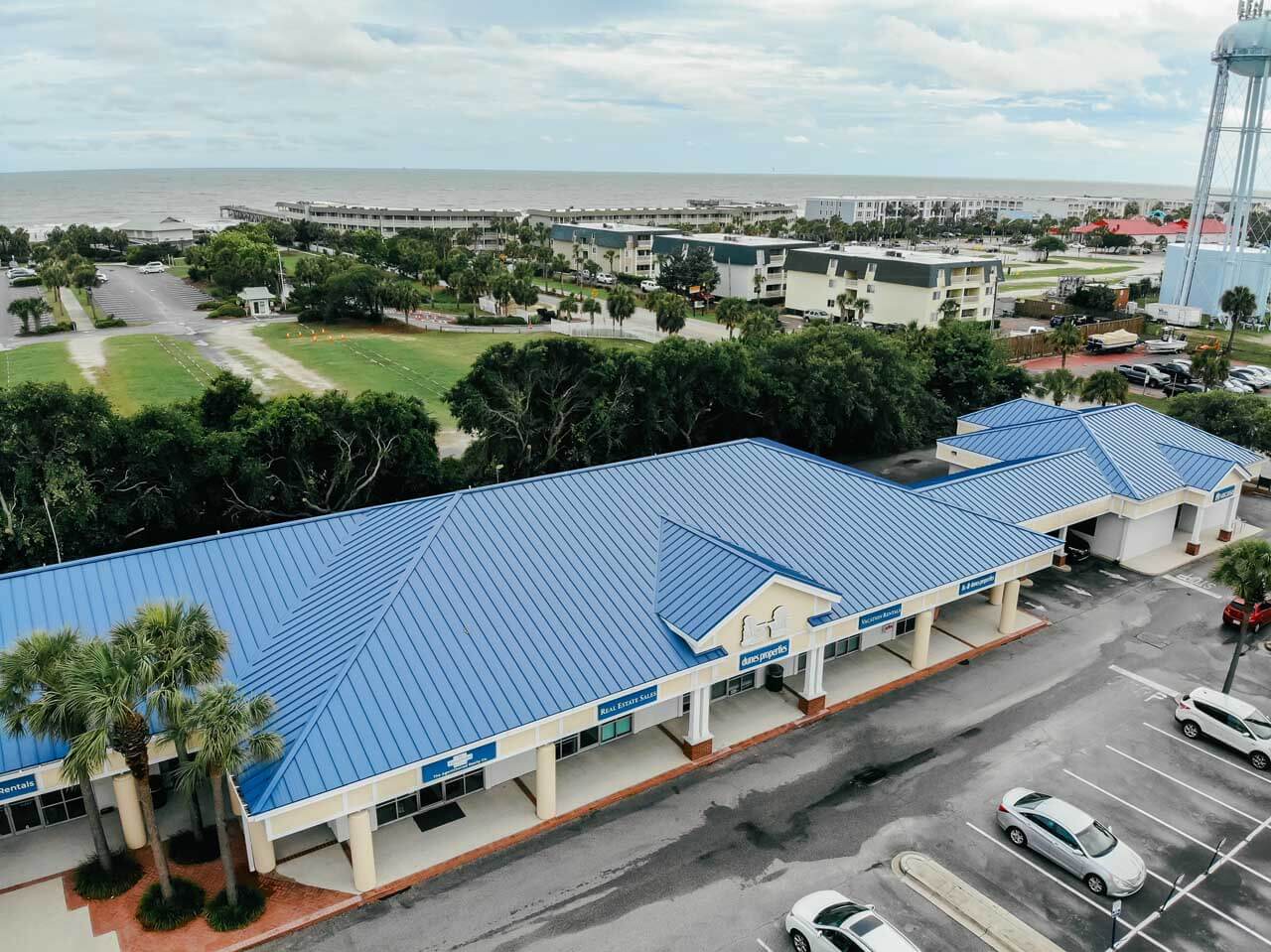 Aerial view of a painted blue metal roof on a shopping center at Isle of Palms beach