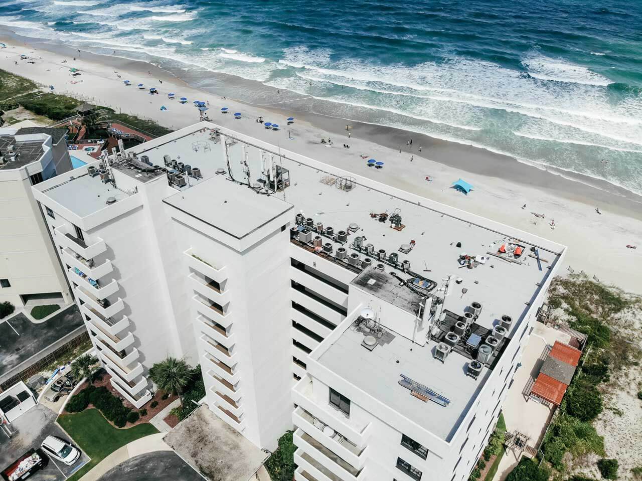 Aerial view of a beachfront condominium building