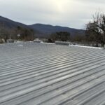 Metal roof restoration on warehouse