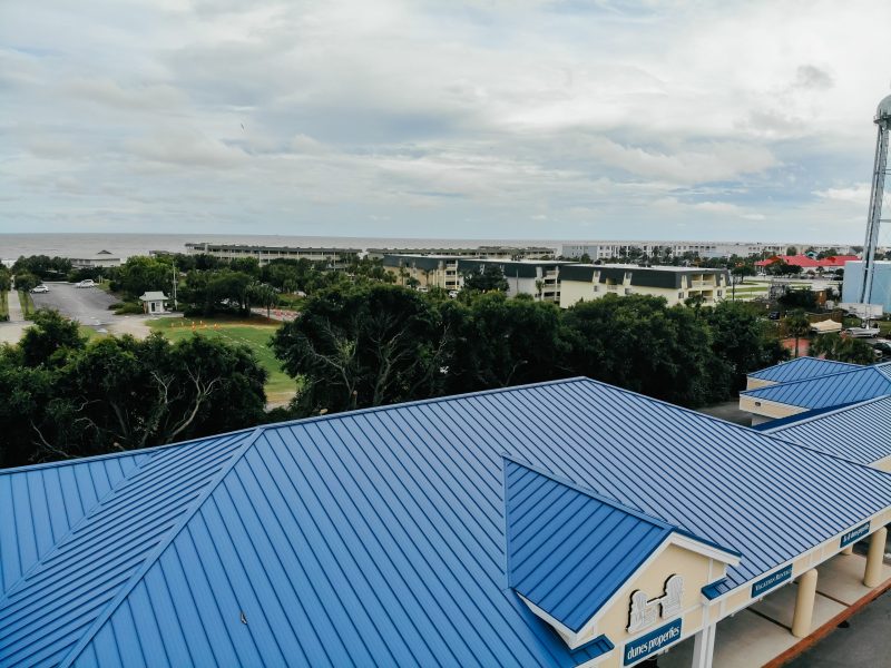 Aerial view of a painted blue metal roof on a shopping center at Isle of Palms beach