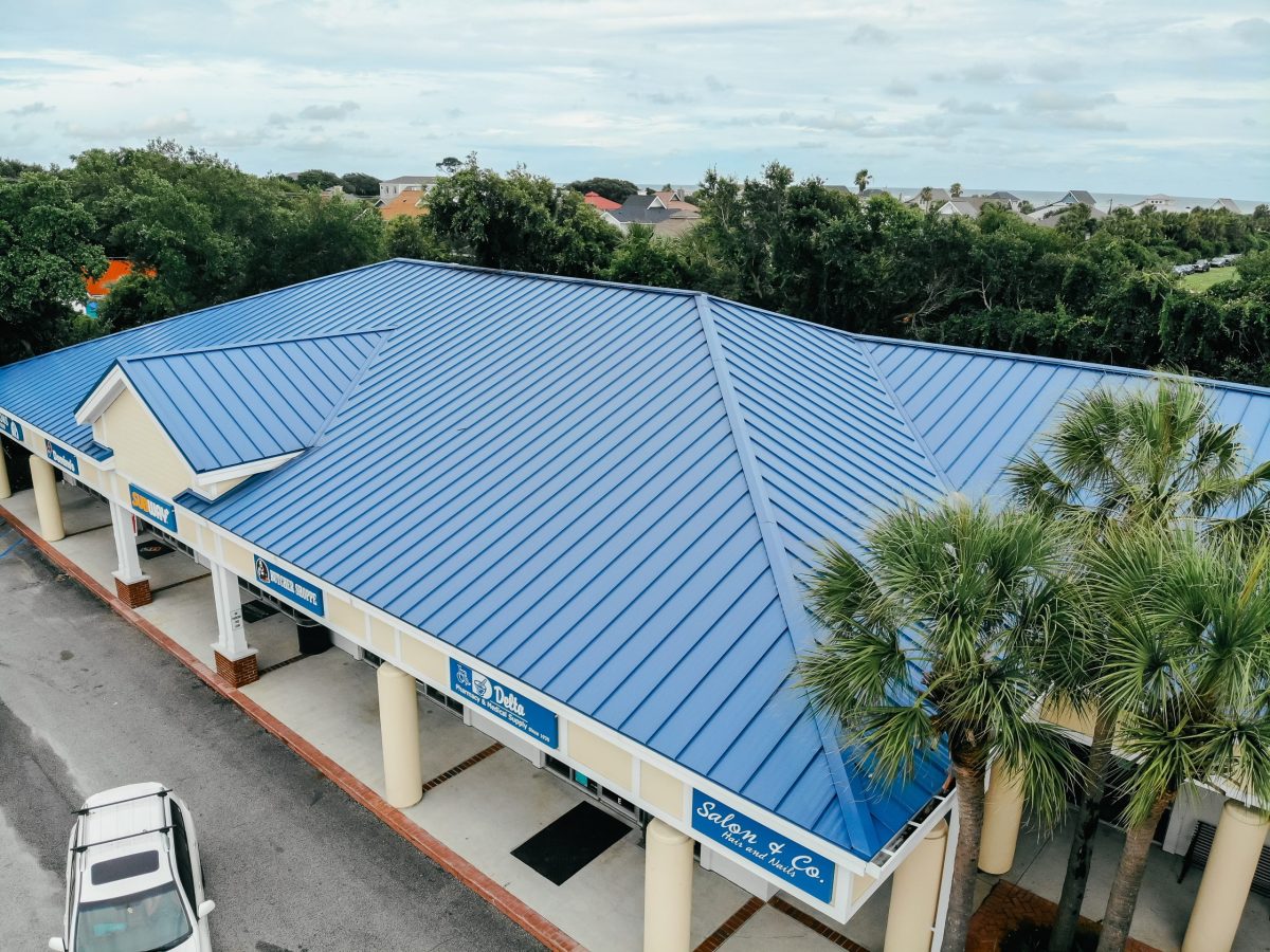 Aerial view of a painted blue metal roof on a shopping center at Isle of Palms beach