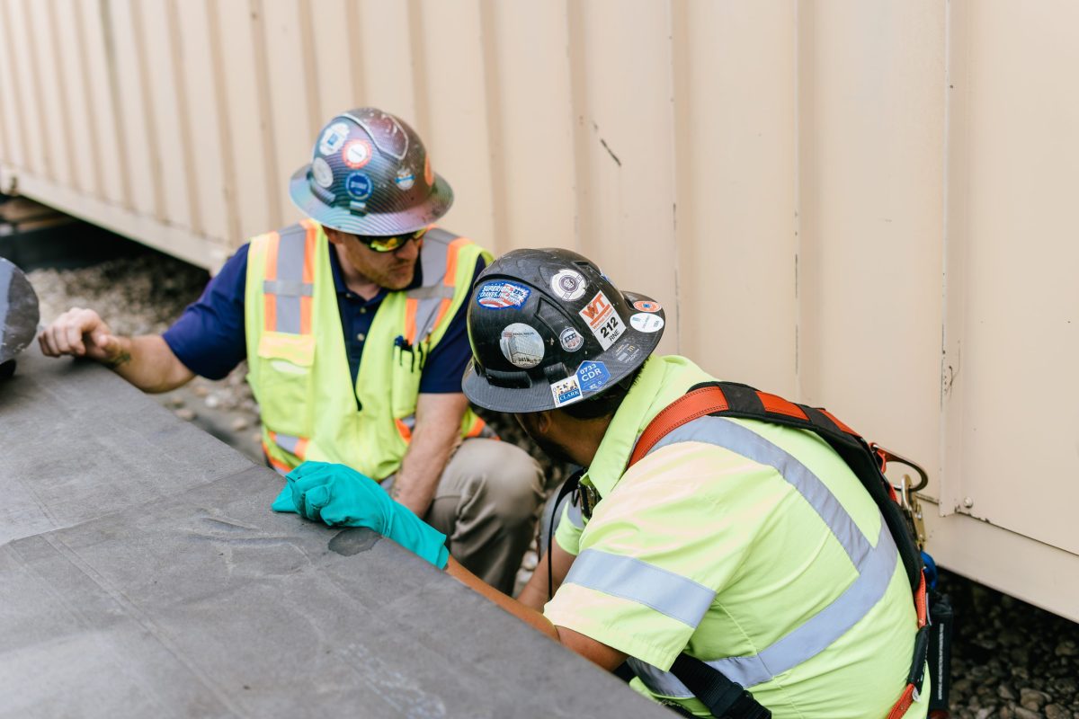 men working on roof