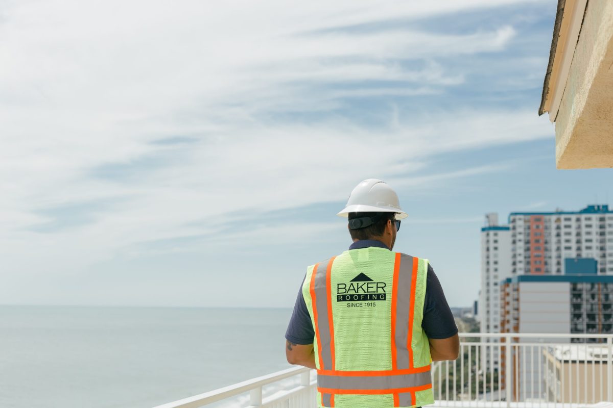 man working on hotel roof