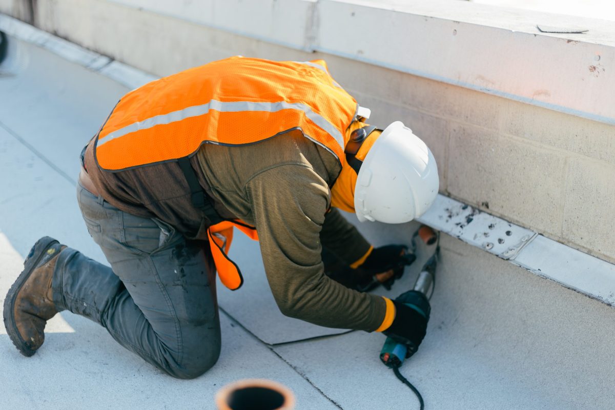 man working on roof