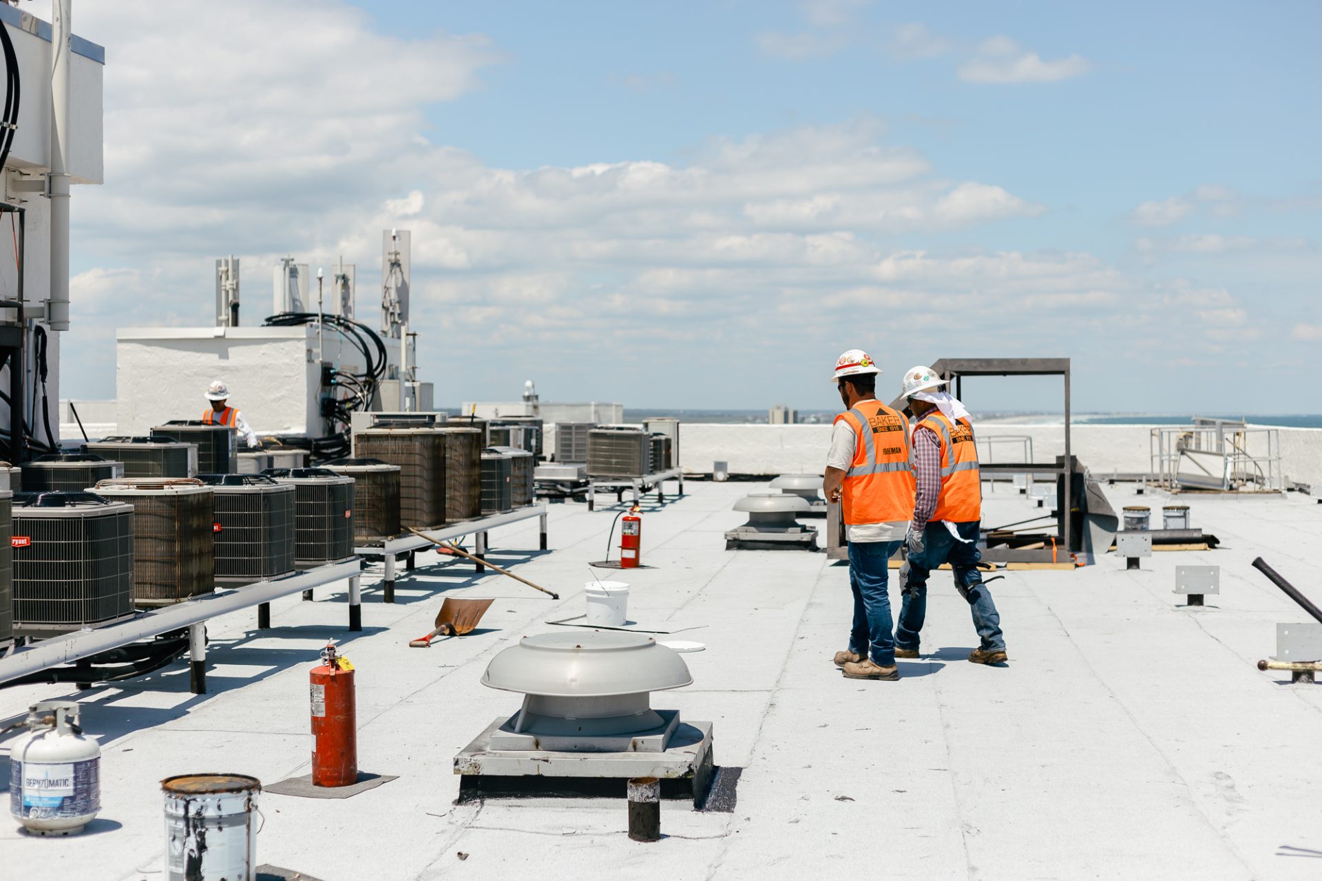 men working on roof