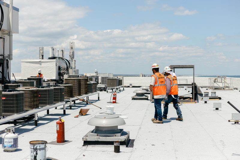 men working on roof