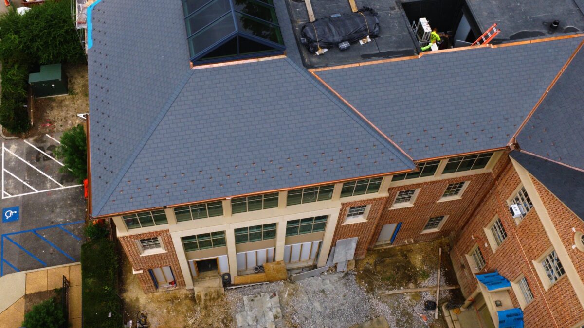 Slate hip roof with copper gutters and skylight on Gates Hall at William & Mary in Williamsburg, VA