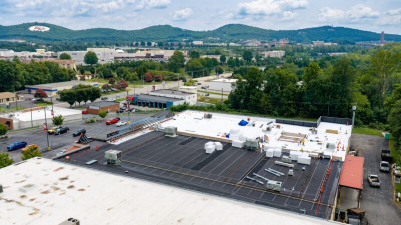 Aerial view of the TPO roof recover in progress at the Boot Barn retail store in Lynchburg, VA