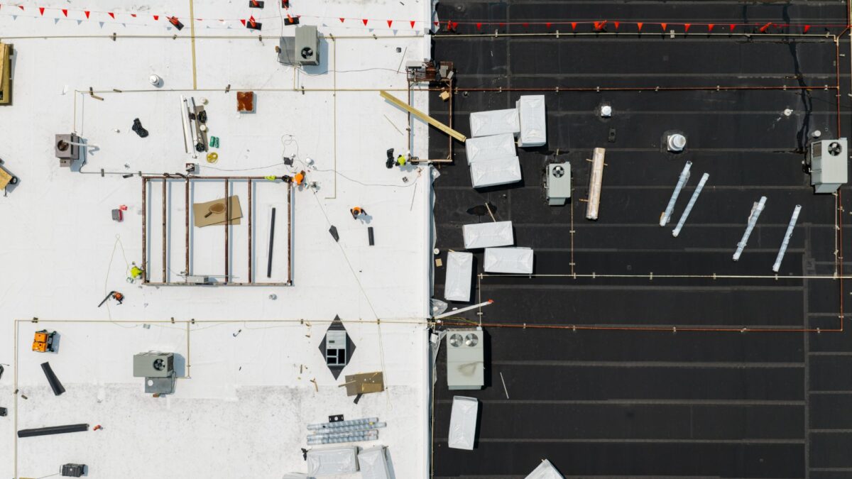 Overhead view of new white TPO membrane next to the existing roof at Boot Barn in Lynchburg, VA