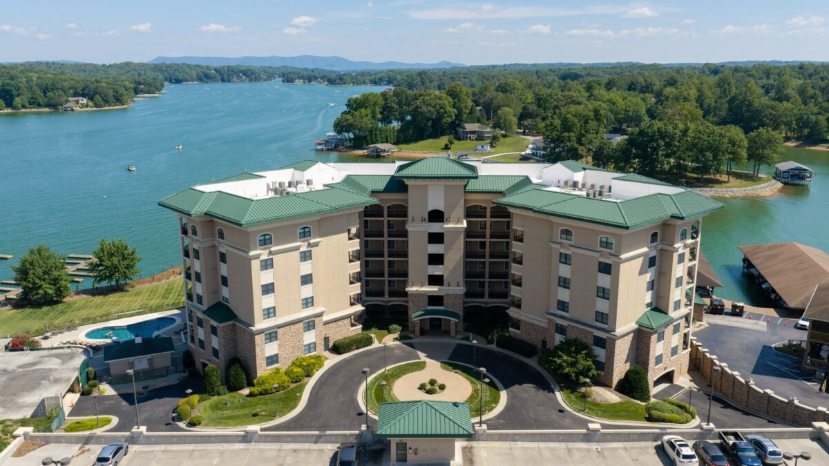 Bridgewater Pointe multifamily building in Moneta, VA with new white TPO roof behind green metal mansards