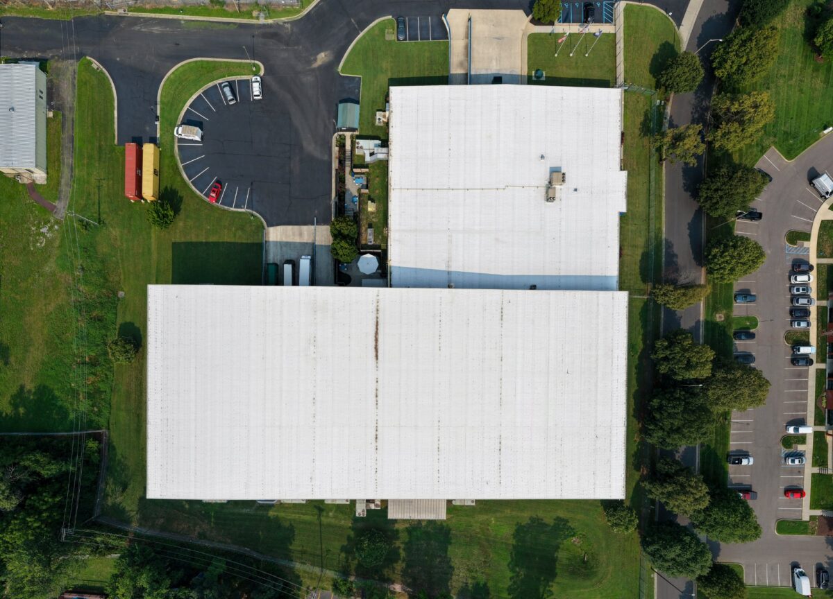 Overhead drone view of the TPO roof installed over metal panels at Foot Levelers' Roanoke, VA facility