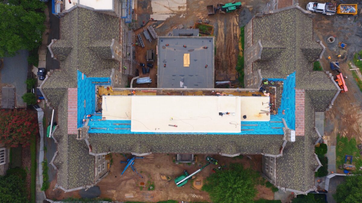 Overhead view of clay tile and copper flat-lock roof replacement in progress on Duke University's Reuben-Cooke Building, Durham, NC