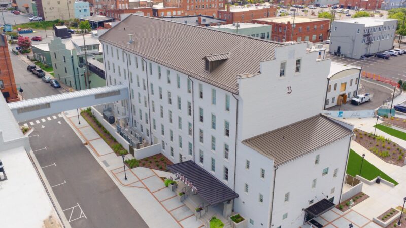 Aerial view of the standing seam metal roof on the historic Sparger Brothers Tobacco Factory, now The Balladeer Hotel, in Mount Airy, NC